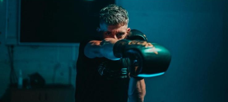 A Focus Fitness member training on the pads