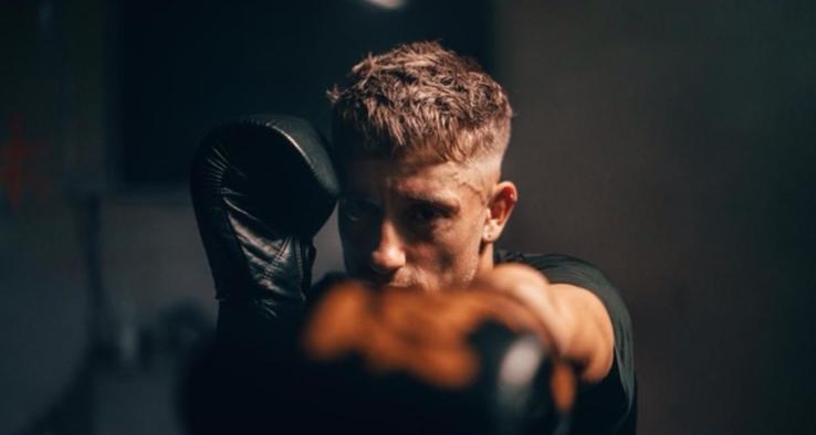 A Focus Fitness boxer throwing a punch in training
