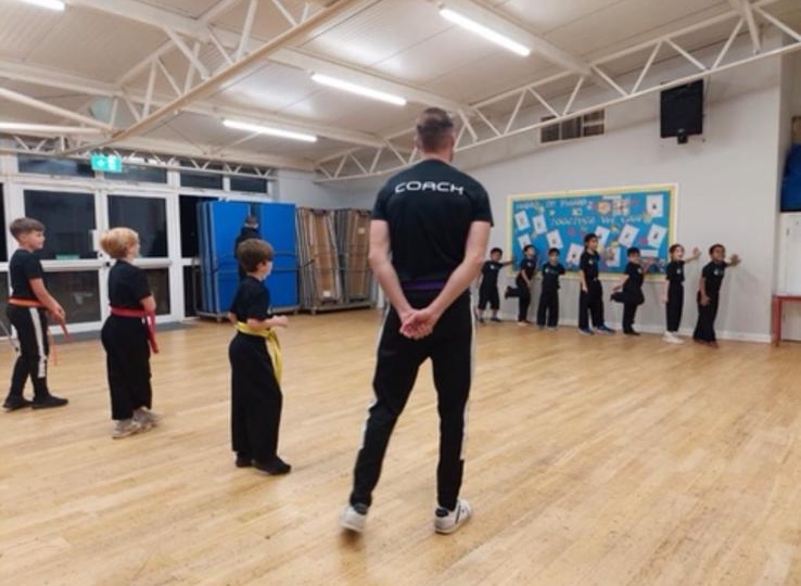 A Focus Fitness coach leading an after school club class