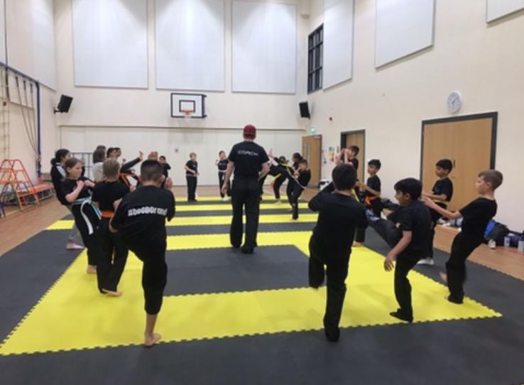 A Focus Fitness kids class training on the mats